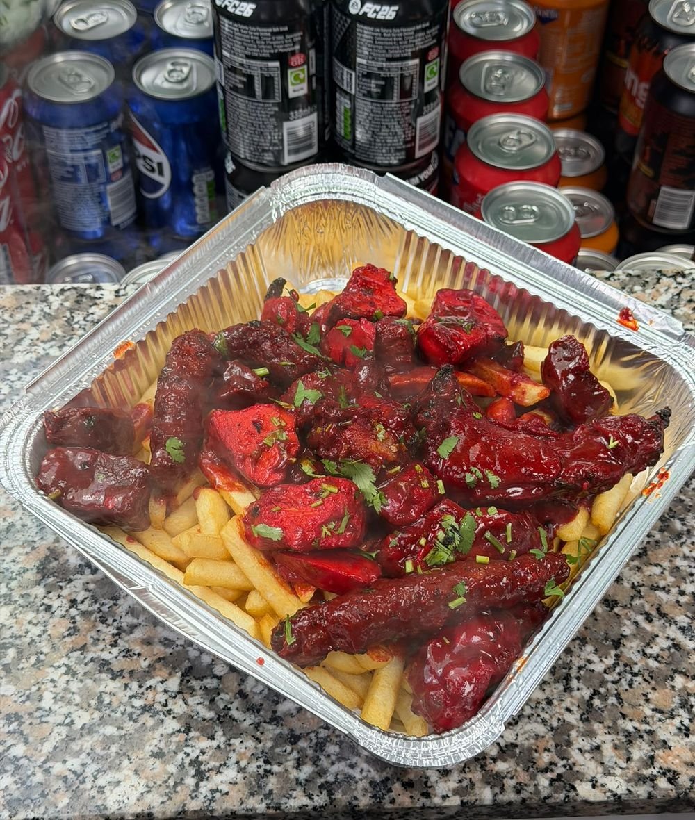 Grilled chicken loaded with the famous red sauce over chips